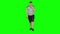 Young man walking and yawns on a Green Screen, Chroma Key