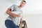 Young man with wallpaper on a ladder