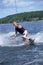 A young man water skiing