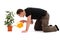 Young man watering flower