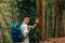 Young man waving while hiking outing