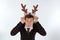 Young man wearing deer\'s horns