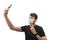 Young man wearing a face mask during the Coronavirus COVID-19 pandemic using his mobile phone to take a selfie