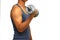 A young man wearing a gray vest lifting a dumbbell isolated on white background