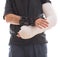 Young man wearing a long arm cast and a splint