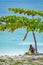 Young man wearing rasta/rastafarian hat on beach