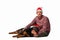 A young man wearing Santa hat sitting with his purebred dog.