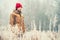 Young Man wearing winter hat clothing outdoor with foggy forest nature on background Travel