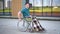 Young man in a wheelchair. A man rides in a wheelchair against the background of a glass building. Special transport for