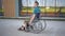 Young man in a wheelchair. A man rides in a wheelchair against the background of a glass building. Special transport for