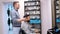 A young man who takes care of the interior of the barber shop. The barber has just finished his work and shows him the