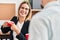 Young man and woman business workers drinking coffee at office