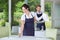 Young man and woman at catering service in restaurant