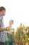 A young man and woman chatting in the vineyards