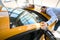 Young man and woman choosing brand new motorcar