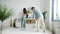 Young man and woman cleaning bathroom washing mirror mopping floor at home