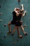 Young Man And Woman Climb Up An Indoors Rock Wall, Athlete People Bouldering