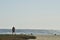 Young man and woman couple silhouettes walking Pacific beach Baja, Mexico