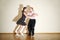 Young man and woman in dress dance at boogie-woogie party.