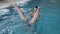 Young man and woman joking and smiling in the pool.