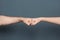 Young man and woman making fist bump