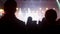 Young man and woman at a music festival enjoying the performance