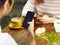 Young man and woman sitting face to face playing with cellphones