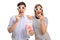 Young man and woman wearing 3D glasses and eating popcorn