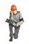 A young man in working grey clothes and orange hard helmet sitting with toolkit on isolated white background.