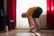 Young man working out, practicing yoga, standing in Ardha Uttanasana