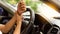 Young man with wrist pain driving long distance travel concept