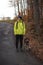 young man in a yellow jacket aged 20-24 on a walk with a Czech mustache  a hunting dog. Binary portrait of taking care of pet