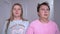 Young married couple in pajamas sees something incredible. They look at each other in disbelief and faint with shock