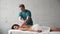 Young masseur doing back Massage dark young girl. Massage scoliosis .