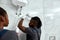 Young mechanic inspecting electrical boiler at home