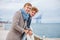 Young men, businessmen are standing on the pier.