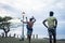 Young men exercising martial arts on beach