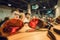 Young men in funny glasses having fun inside sunglasses store