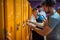 Young men in the gym locker room preparing for workout, getting dressed and hanging out together