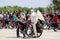 Young men in helmets and an angel costume with wings cycling, bicycle festival in the City Dnipro. Bike Day Dnepropetrovsk