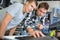 Young men looking at electronic keyboard