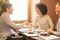 Young men shaking hands, reached agreement during business lunch