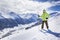 Young men with ski on a mountain winter resort