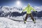 Young men on skies in winter mountain resort