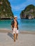 young men with swimshort and hat on the beach of Maya Bay Koh Phi Phi Thailand