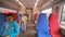 Young men travel in comfort chairs on electric train