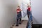 Young Men In Uniform Carrying Mattress Downward