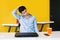 Young mexican man meditating and doing yoga in office in Latin America