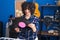 Young middle east woman musician listening music holding vinyl disc at music studio