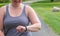 Young millennial mom tracking fitness on smart watch